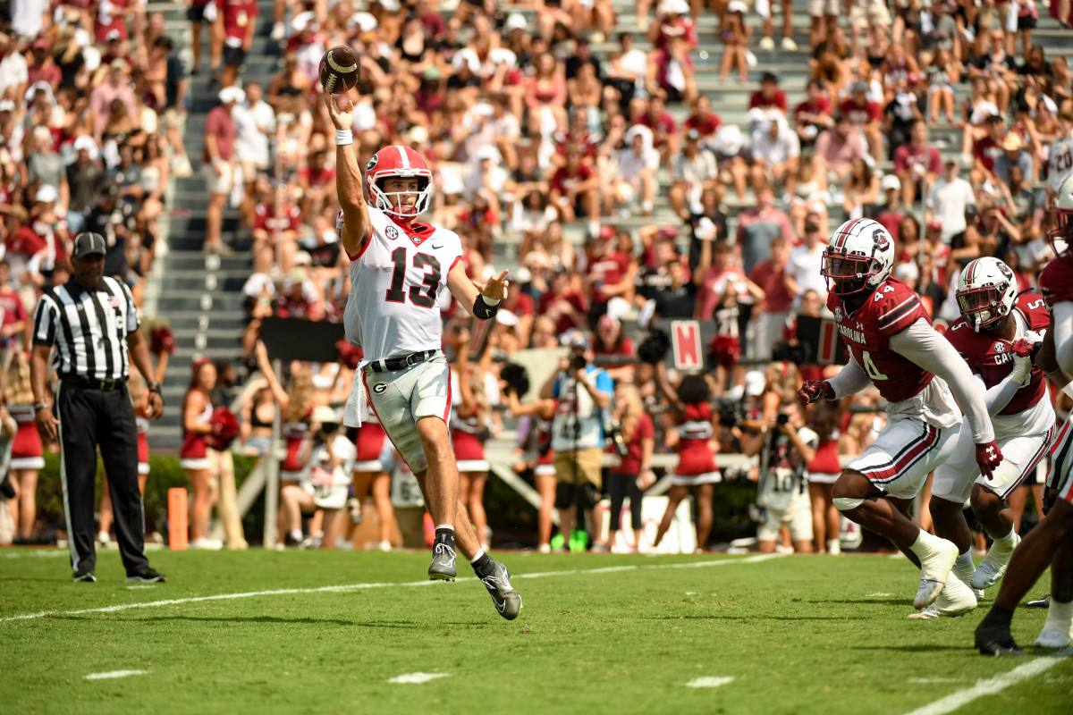 Stetson Bennett scrambles out of the pocket to complete a pass.
